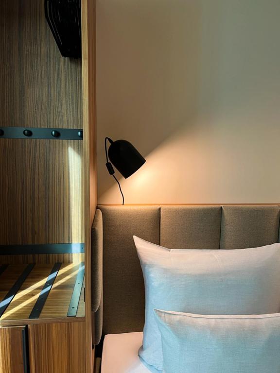 Postel nebo postele na pokoji v ubytování Cocoon Sendlinger Tor