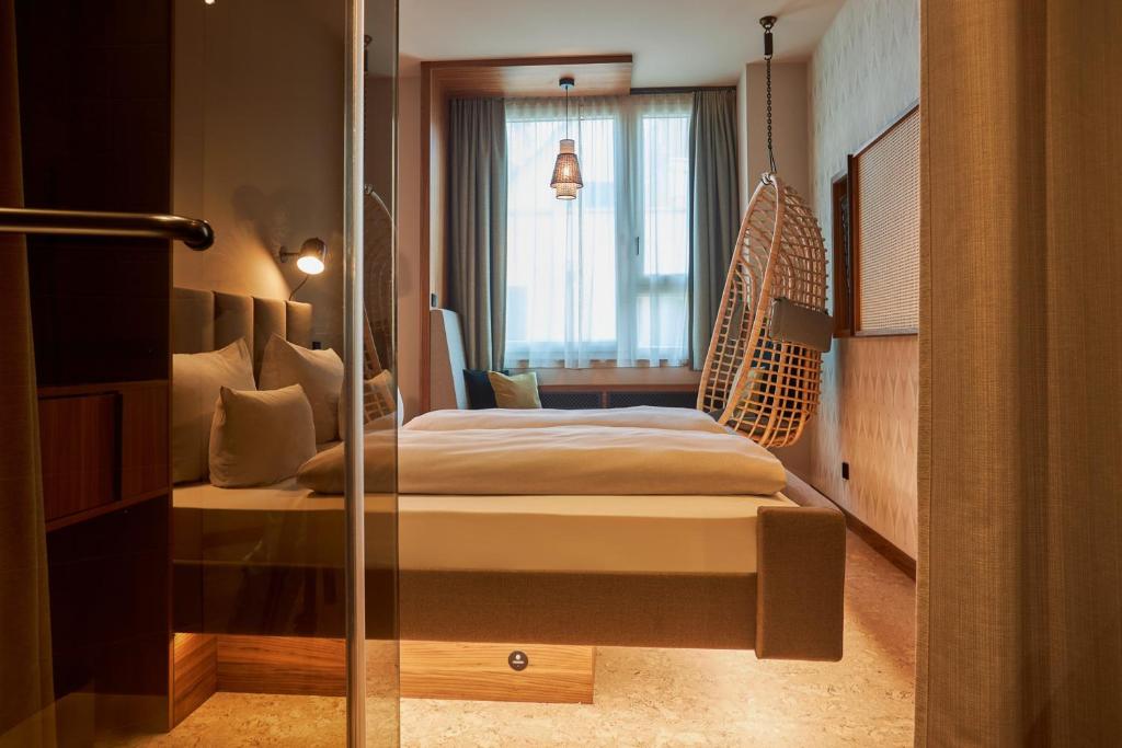 Postel nebo postele na pokoji v ubytování Cocoon Sendlinger Tor