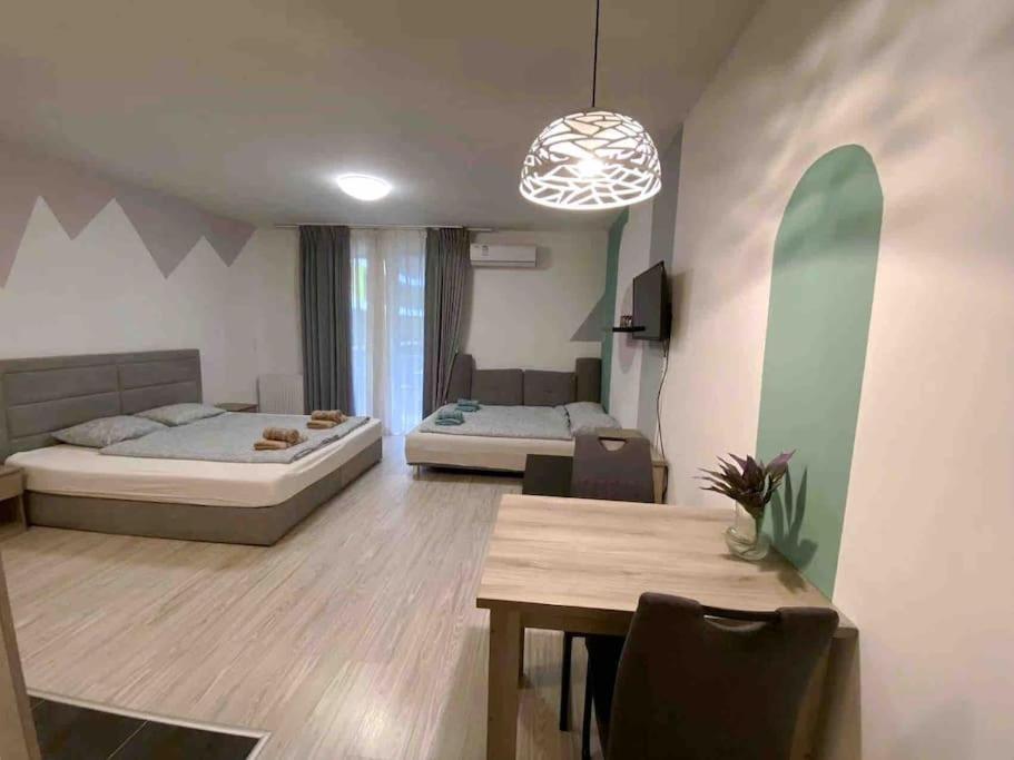 A bed or beds in a room at Corvin cozy and peaceful Apartment 313