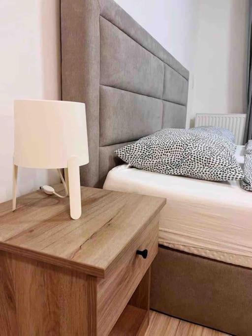 A bed or beds in a room at Corvin cozy and peaceful Apartment 313