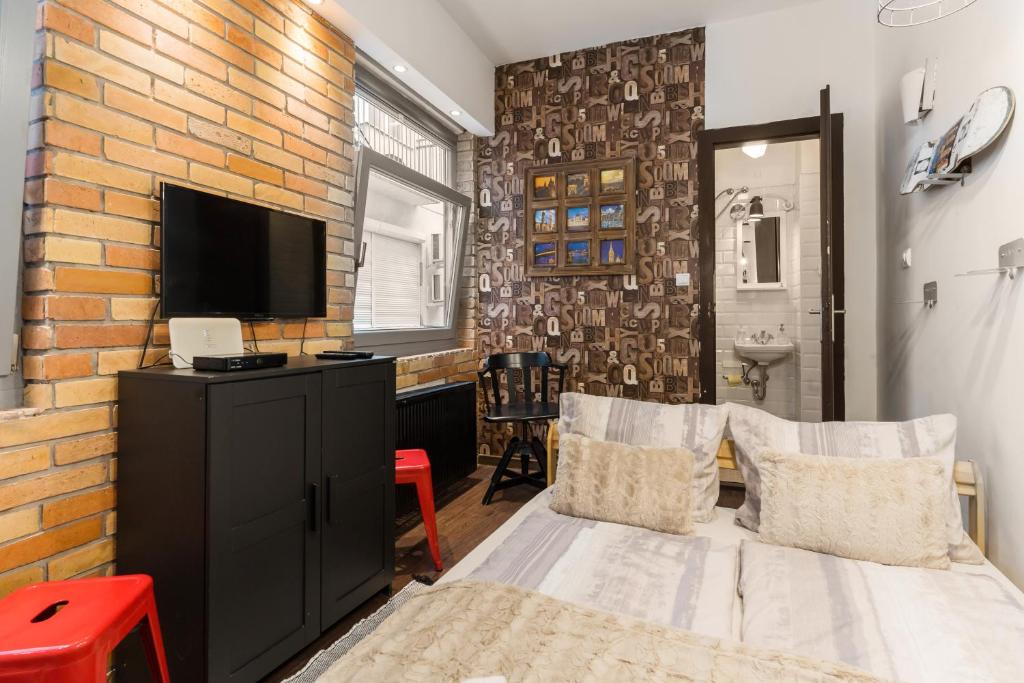Posteľ alebo postele v izbe v ubytovaní Cheerful studio Budapest downtown