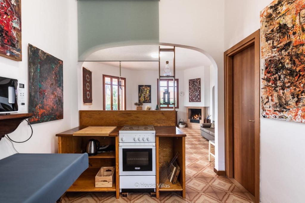 Telewizja i/lub zestaw kina domowego w obiekcie House&Villas - Due Palme