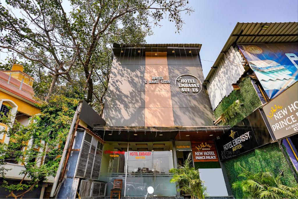 a building with a sign on the side of it at FabHotel New Prince Palace in Mumbai