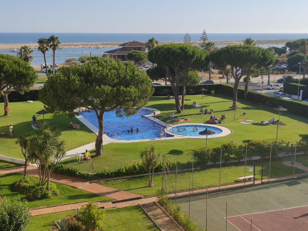 an aerial view of a park with a swimming pool at Apto con vistas Monteluna in Huelva