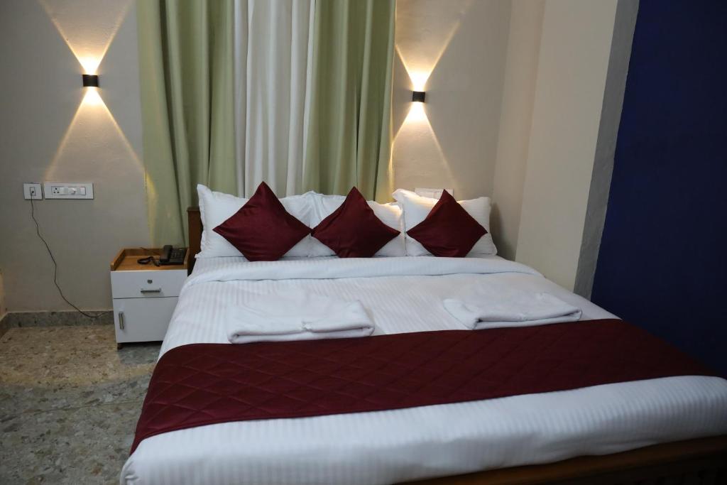 Postel nebo postele na pokoji v ubytování Dreams Paradise Airport Residency