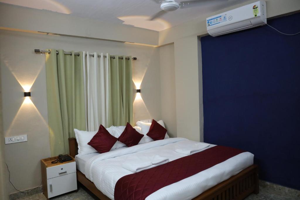 Postel nebo postele na pokoji v ubytování Dreams Paradise Airport Residency