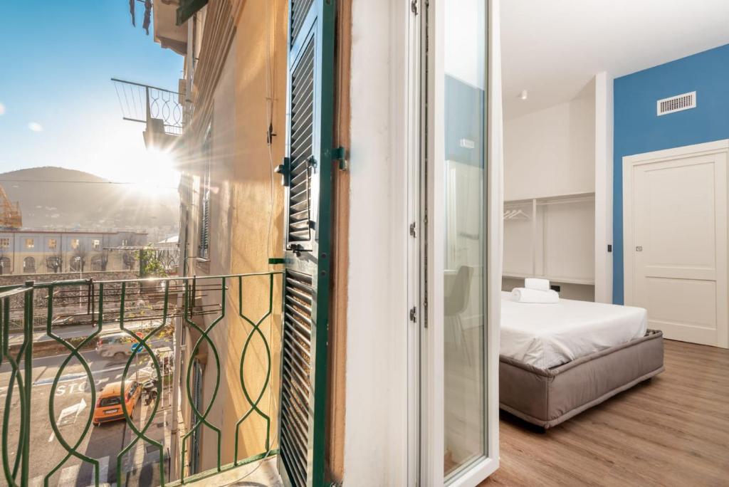Posteľ alebo postele v izbe v ubytovaní Nelli Rooms Via Biassa