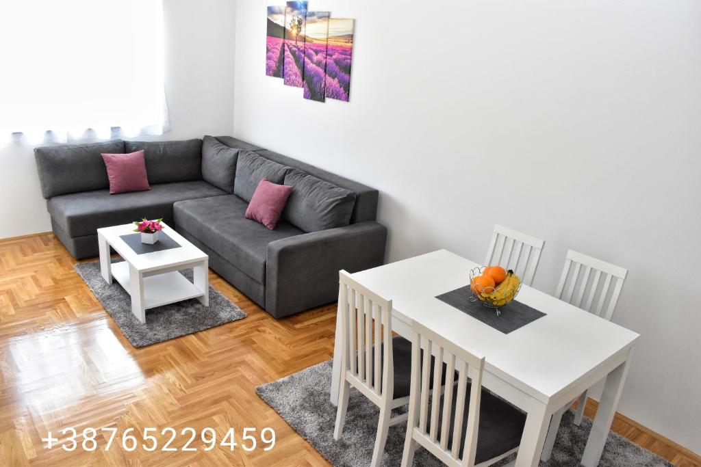 a living room with a couch and a table at Apartman Dajana in Trebinje