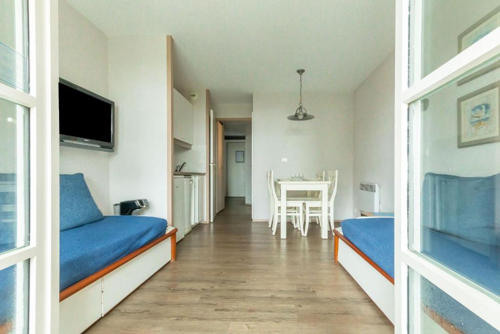 Postel nebo postele na pokoji v ubytování Le Motu
