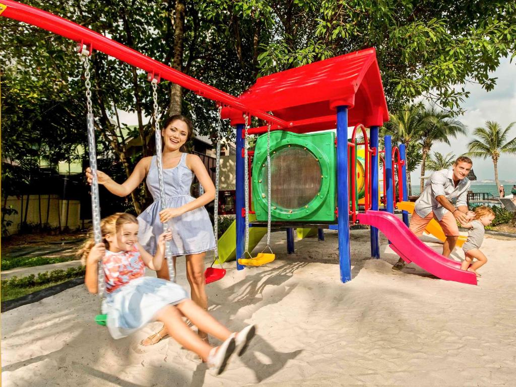 a group of people playing on a playground at Hotel Ibis Samui Bophut in Bophut