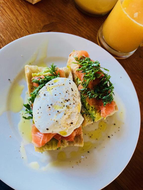 a plate of food with an egg on top of toast at Amama Baita in Urrugne