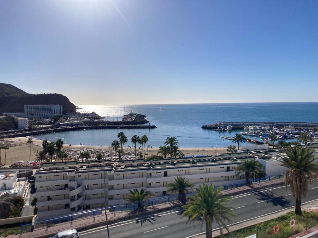 a view of a beach and buildings and the ocean at Tobago508 in Puerto Rico de Gran Canaria