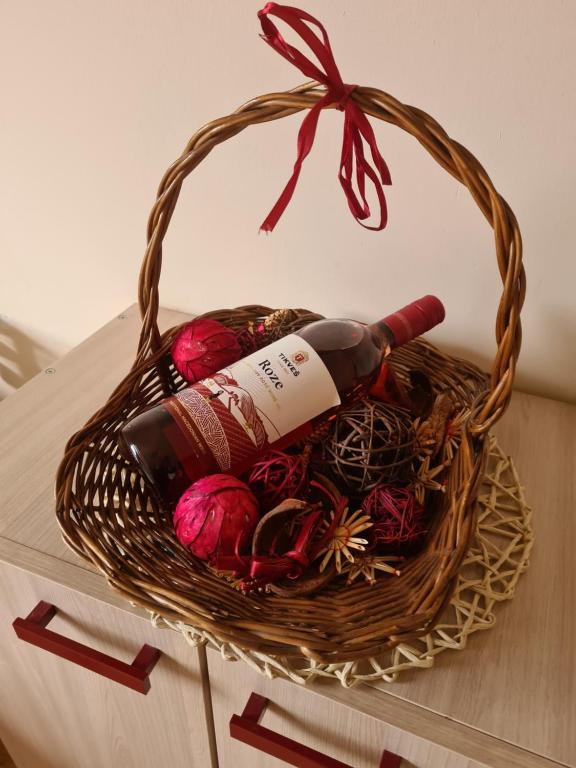 a basket filled with wine bottles on a table at Vojvoda in Belgrade