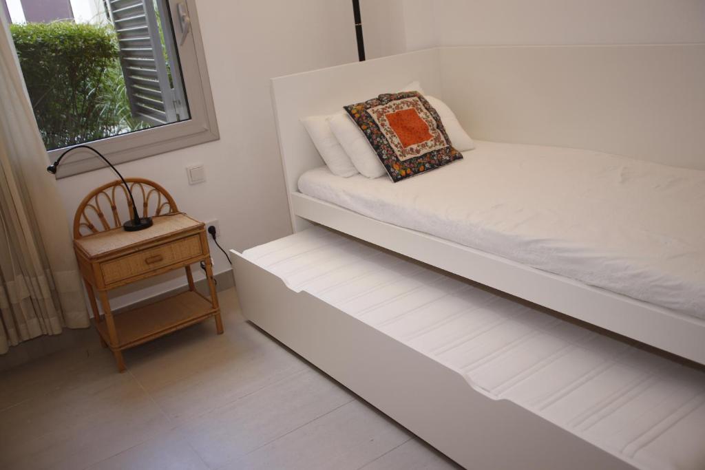Postel nebo postele na pokoji v ubytování AT117 Planta baja con piscina, airco y a unos pasos de la playa