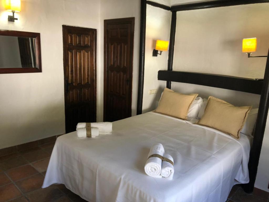 Postel nebo postele na pokoji v ubytování Hotel Apartamento Nueva Alcazaba
