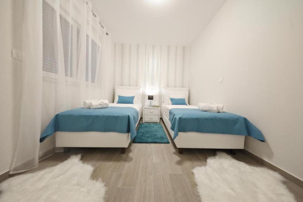Posteľ alebo postele v izbe v ubytovaní Luxury Majpruz Suites I