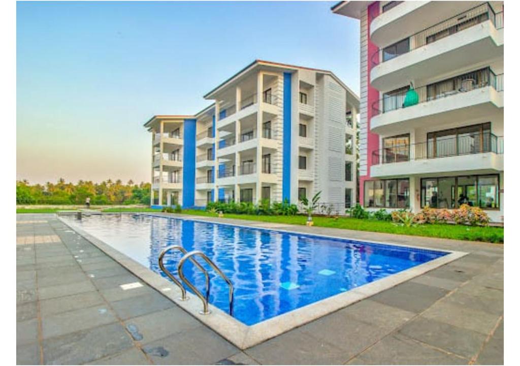 Bazén v ubytování Telferk Acron Seawinds Apartment- Baga nebo v jeho okolí