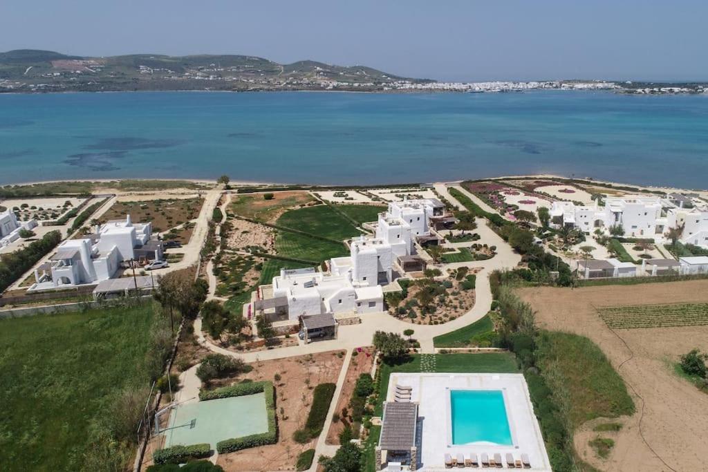 an aerial view of a resort near the water at SUNRAY Paros Beach front 2 bedroom house next to kite sports in Kampos Paros