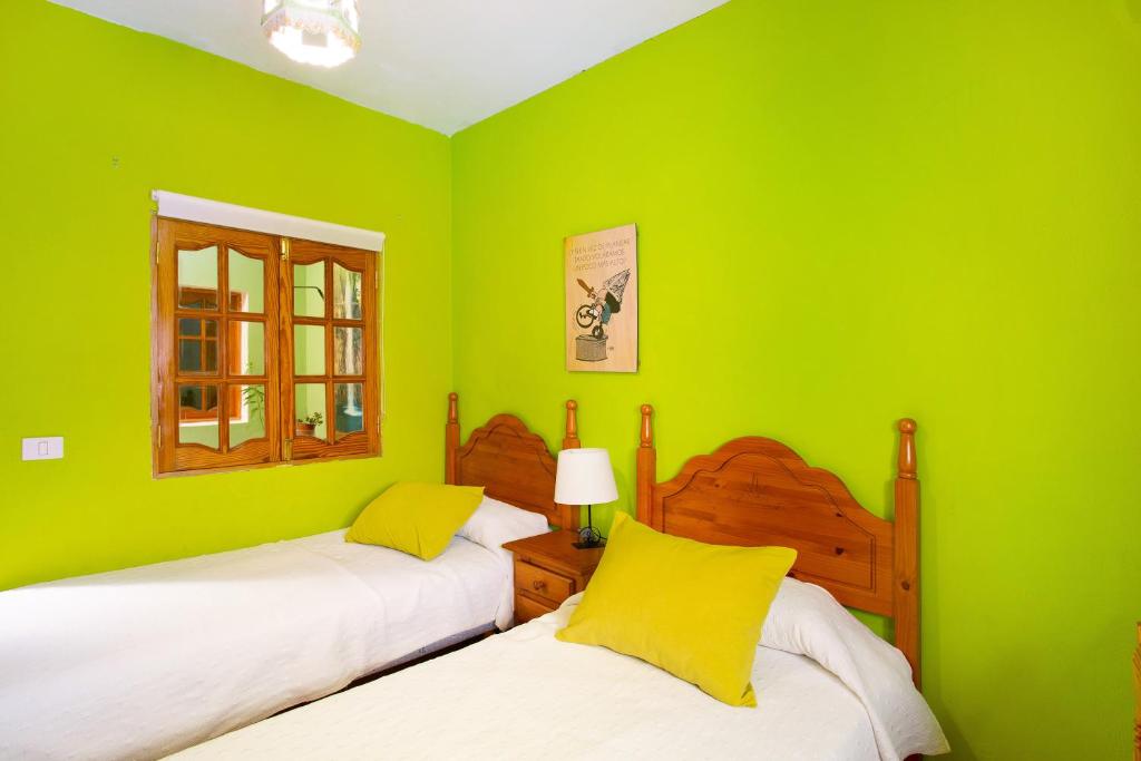 A bed or beds in a room at Finca Tropical