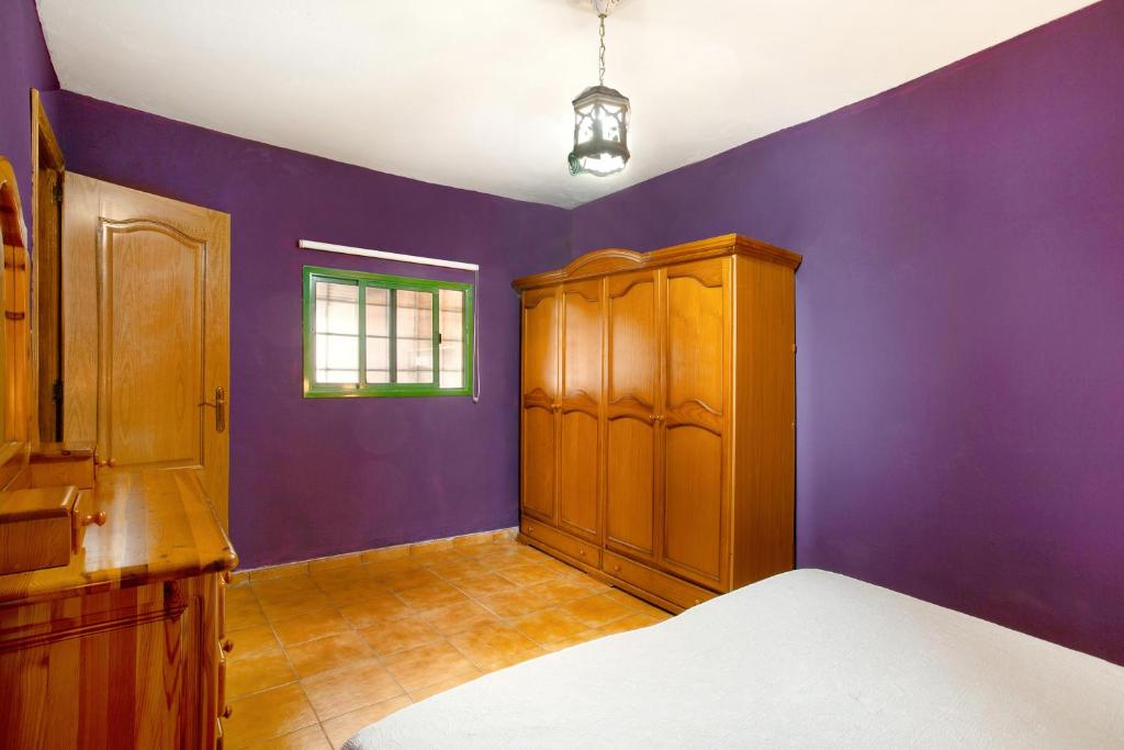 A bed or beds in a room at Finca Tropical