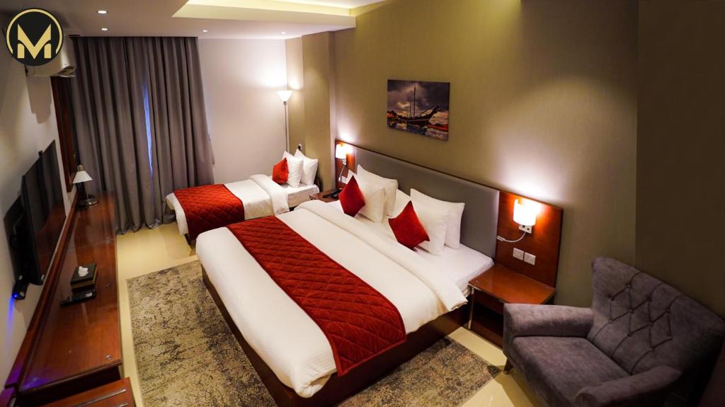 Postel nebo postele na pokoji v ubytování Muscat Express Hotel