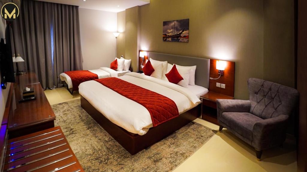 Postel nebo postele na pokoji v ubytování Muscat Express Hotel