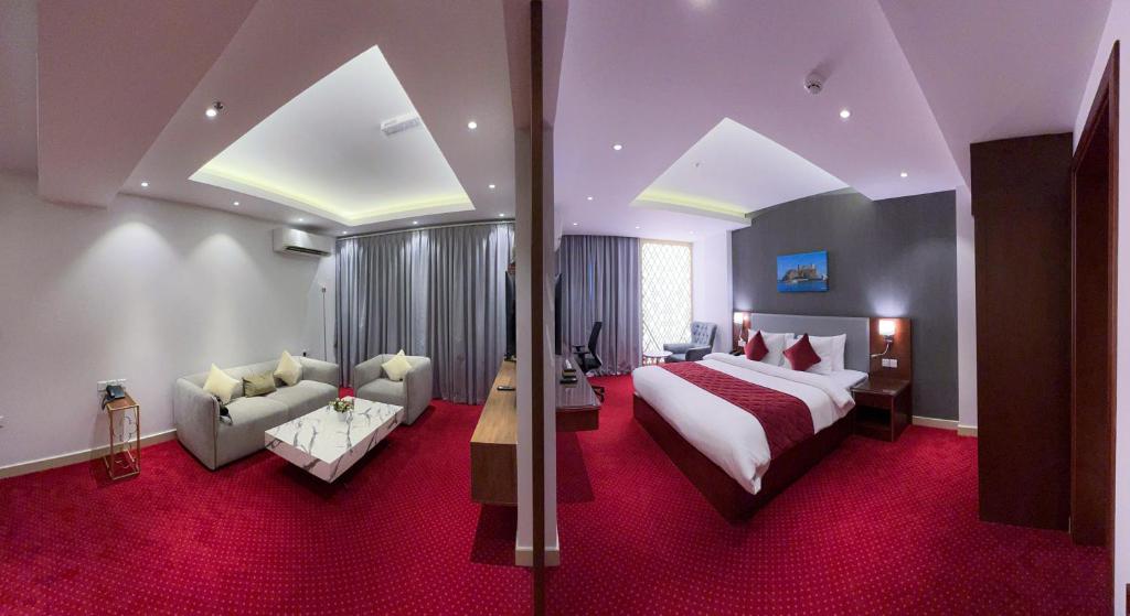 Postel nebo postele na pokoji v ubytování Muscat Express Hotel