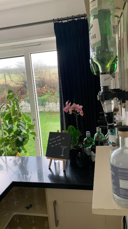 a counter in a kitchen with a window and a counter top at Ramsey House - Luxury Licensed B&B - Parking and Guest Lounge in St. Davids