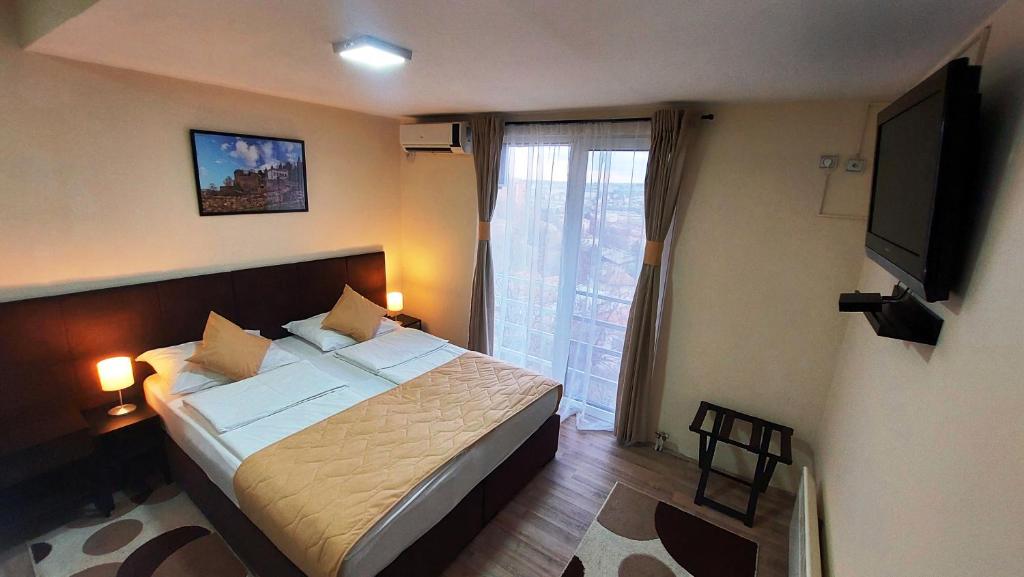 Postel nebo postele na pokoji v ubytování Hotel Villa Panorama