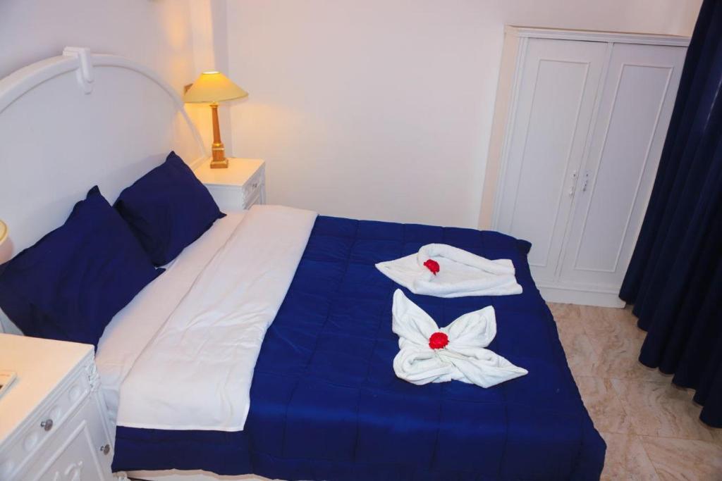 Postel nebo postele na pokoji v ubytování Luxor Oasis Guest House