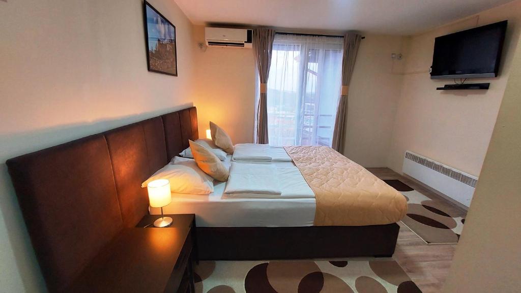 Postel nebo postele na pokoji v ubytování Hotel Villa Panorama