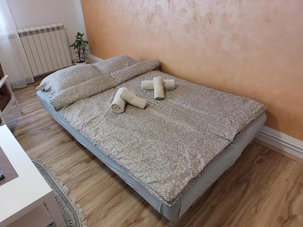 Postel nebo postele na pokoji v ubytování Apartman Centar