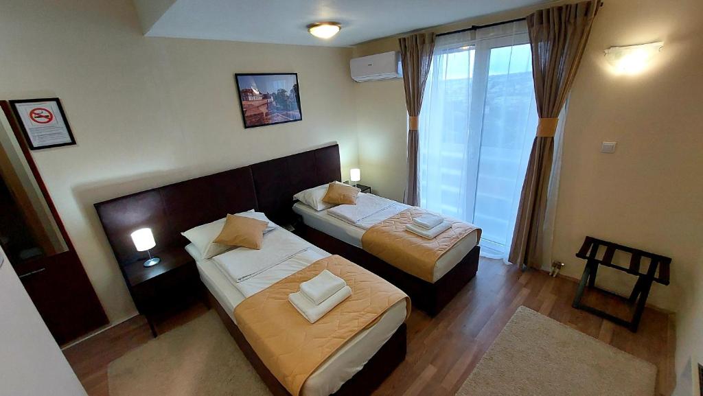 Postel nebo postele na pokoji v ubytování Hotel Villa Panorama
