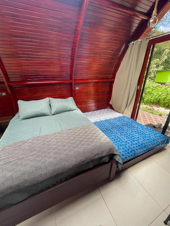 Postel nebo postele na pokoji v ubytování Glamping Campo Alegre