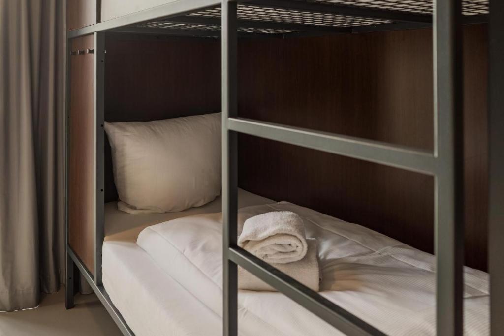 Postel nebo postele na pokoji v ubytování City Hostel Dormitory