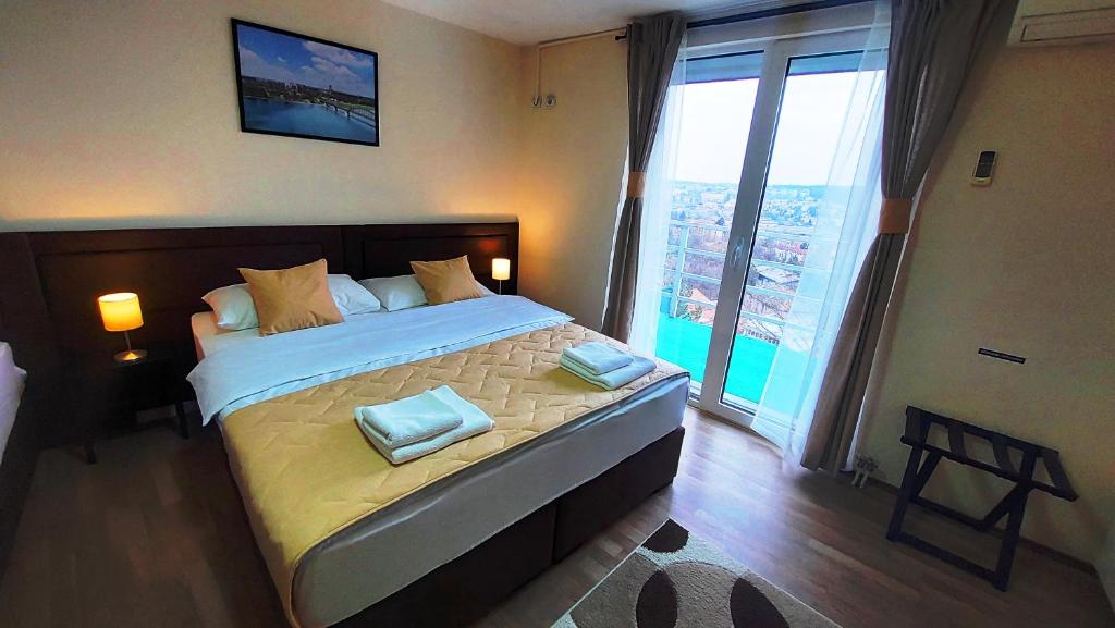 Postel nebo postele na pokoji v ubytování Hotel Villa Panorama