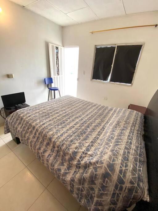 Ένα ή περισσότερα κρεβάτια σε δωμάτιο στο 2023 Apartamentos Múltiples Segundo Piso Casa Independiente