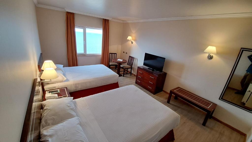 Postel nebo postele na pokoji v ubytování Hotel Diego de Almagro Punta Arenas