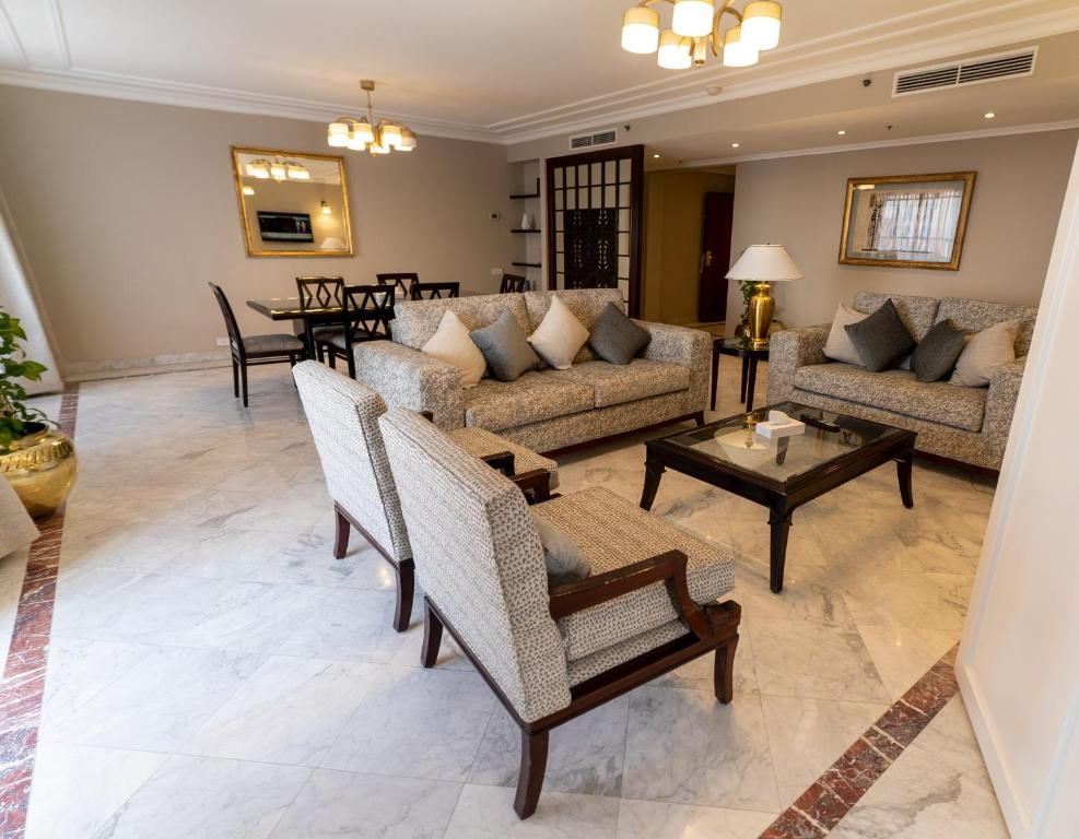 a living room with couches and a table at Cairo World Trade Center Hotel & Residences in Cairo