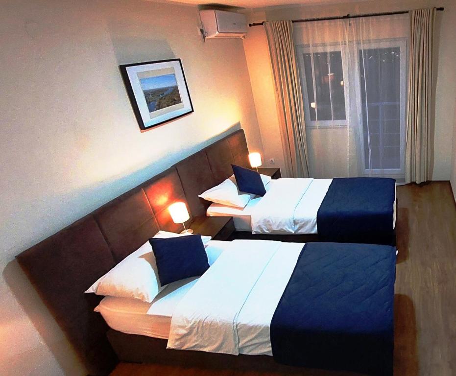 Postel nebo postele na pokoji v ubytování Hotel Villa Panorama