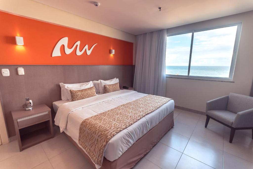 Ένα ή περισσότερα κρεβάτια σε δωμάτιο στο Real Classic Bahia Hotel