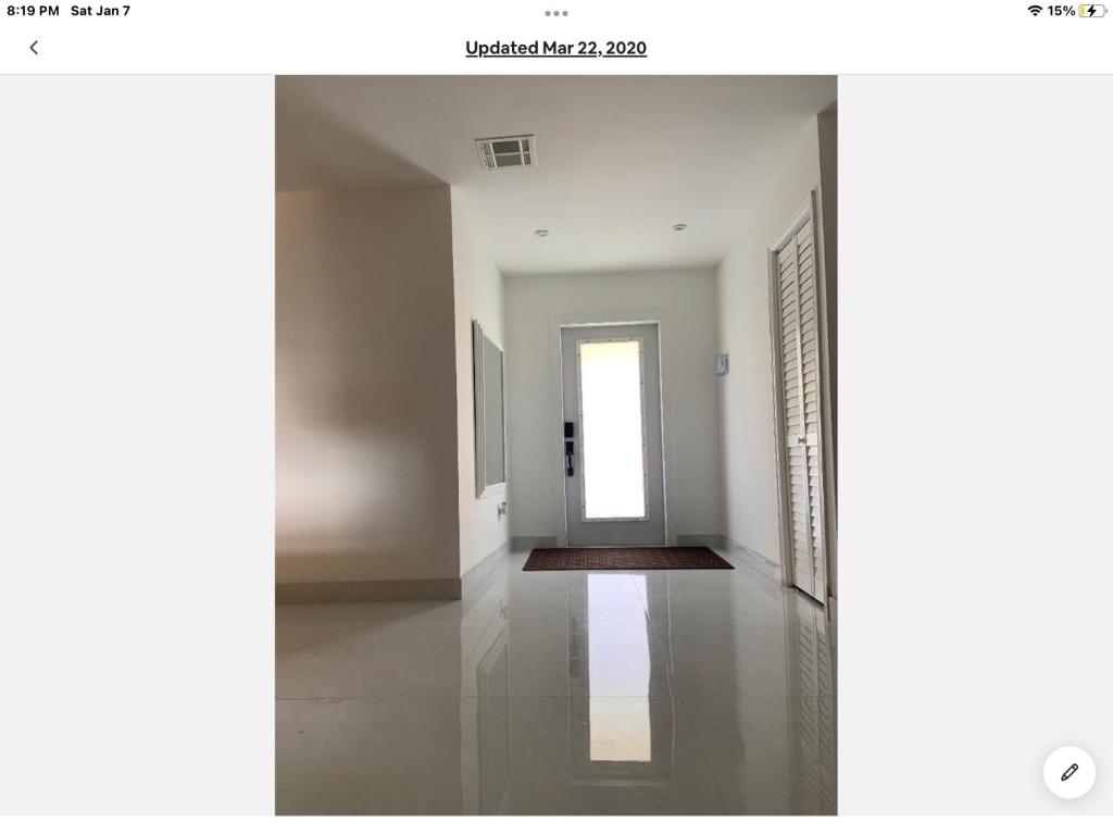 an empty room with a door and a hallway at room & private bathroom in Boca Raton