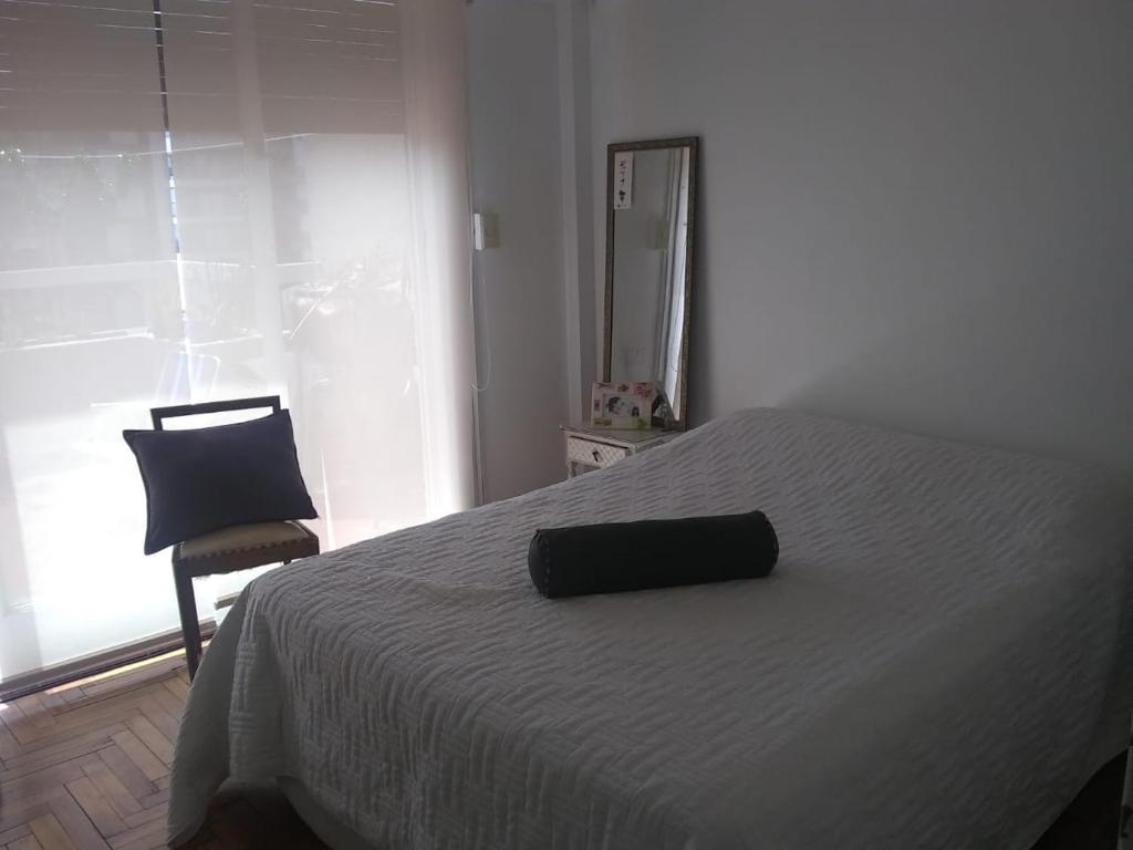 Tempat tidur dalam kamar di Palermo Sol