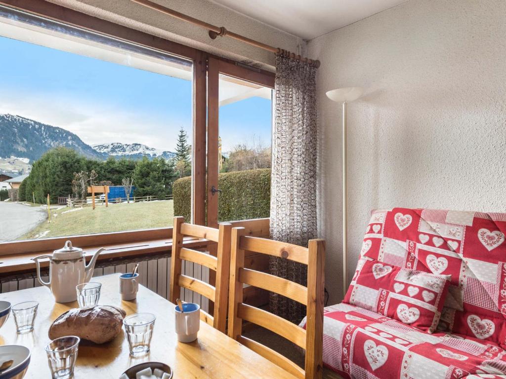 a room with a table and a chair and a window at Appartement Megève, 2 pièces, 4 personnes - FR-1-453-63 in Megève