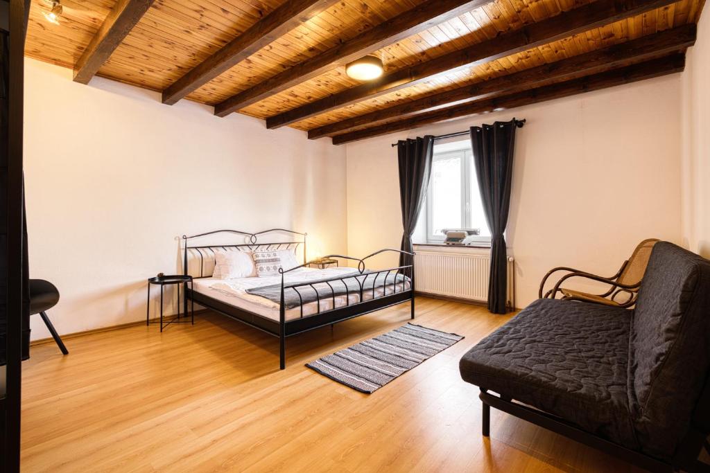 Postel nebo postele na pokoji v ubytování Apartmány Pod Šerákem