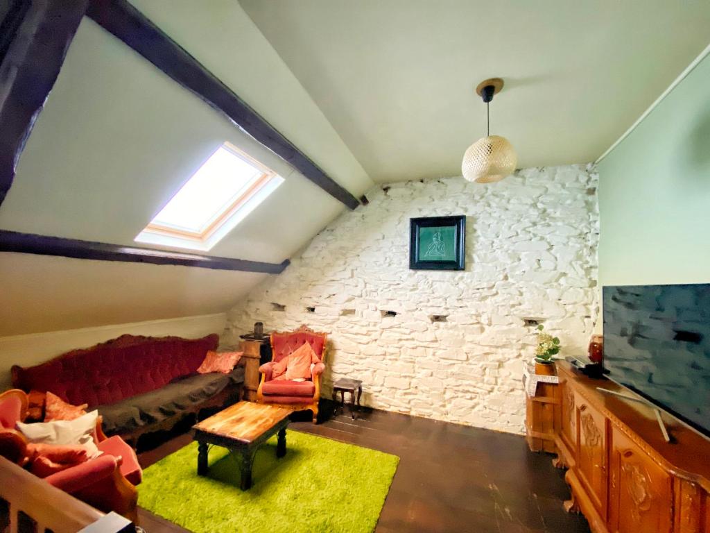 Posezení v ubytování Maison Maissin