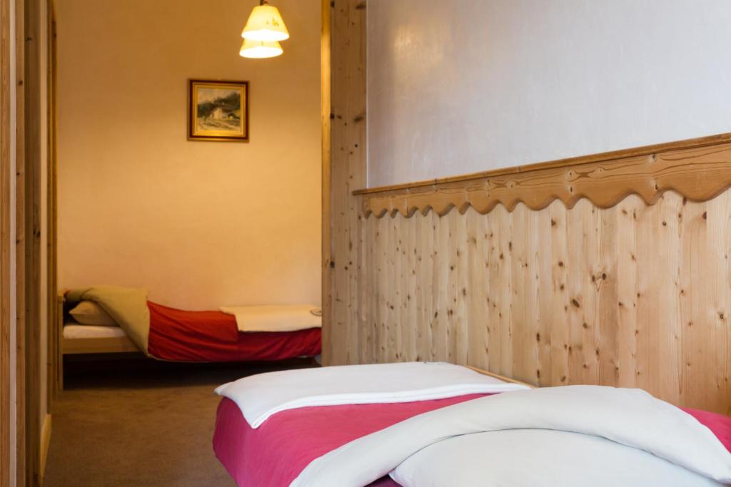 Postel nebo postele na pokoji v ubytování Chalet Matsuzaka - chambres d'hôtes de luxe