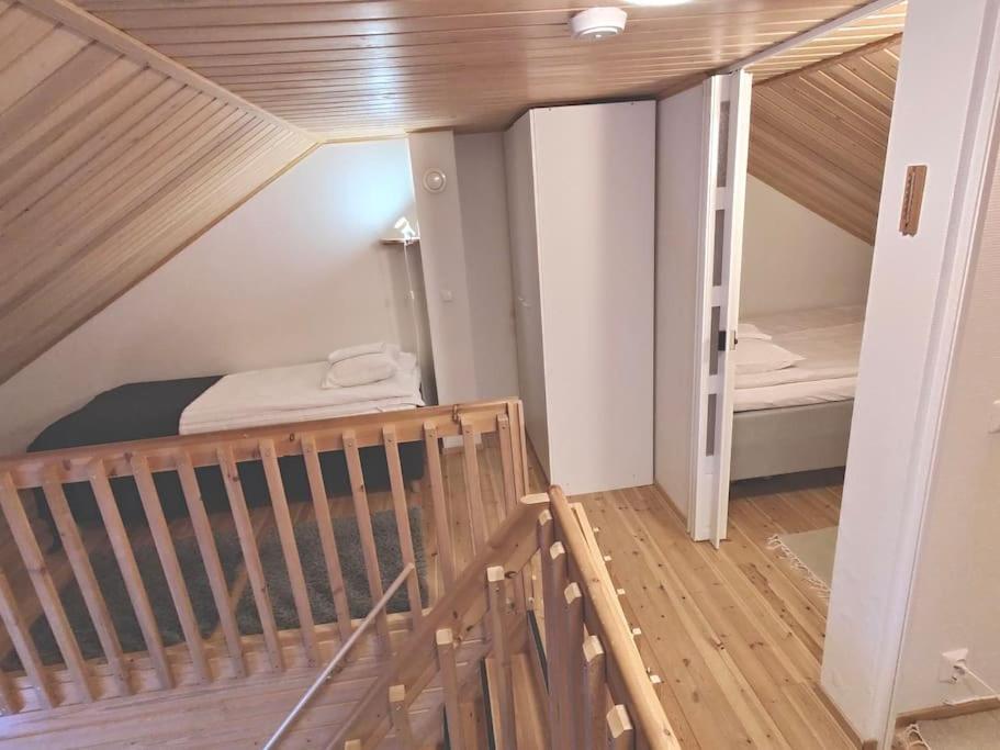 a room with a staircase and a bunk bed at Gold Legend Paukkula #4 - Saariselkä Apartments in Saariselka