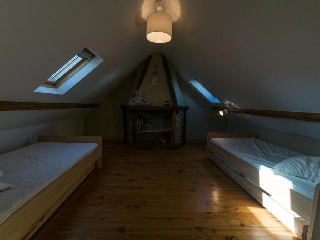 Postel nebo postele na pokoji v ubytování Maison de charme au cœur du Palais avec jardin, proche commerces et plage - FR-1-418-77