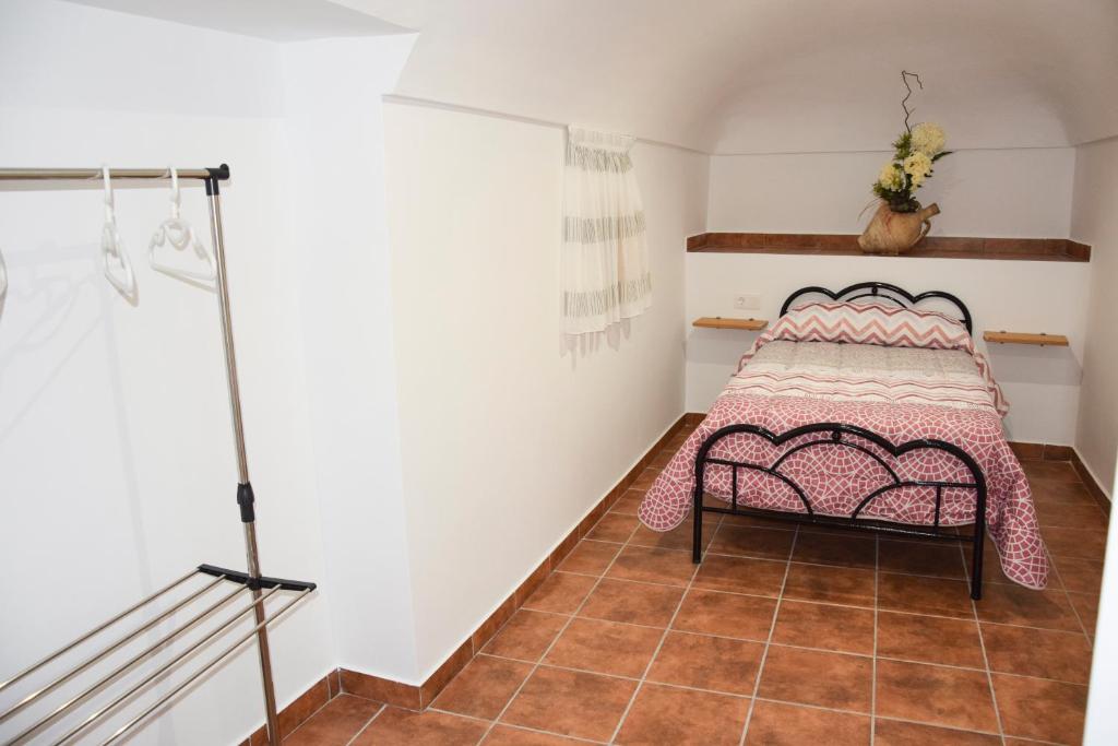Posteľ alebo postele v izbe v ubytovaní Cueva Rural Las Palmeras